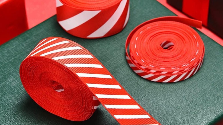 Candy stripe ribbons against a green surface