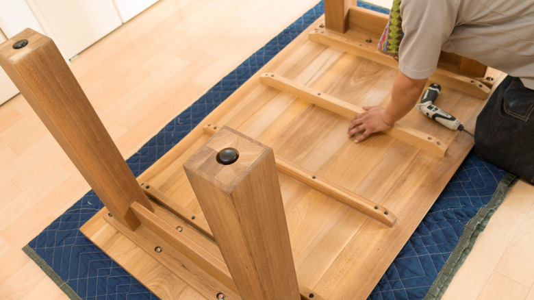 Man assembling table