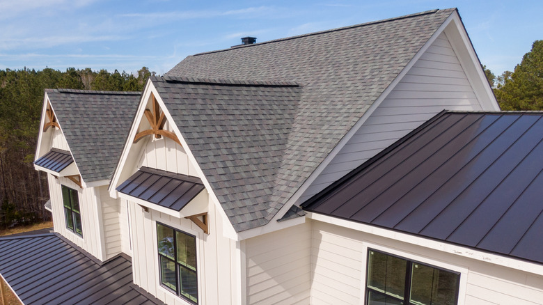 A modern home with a roof covered in asphalt shingles