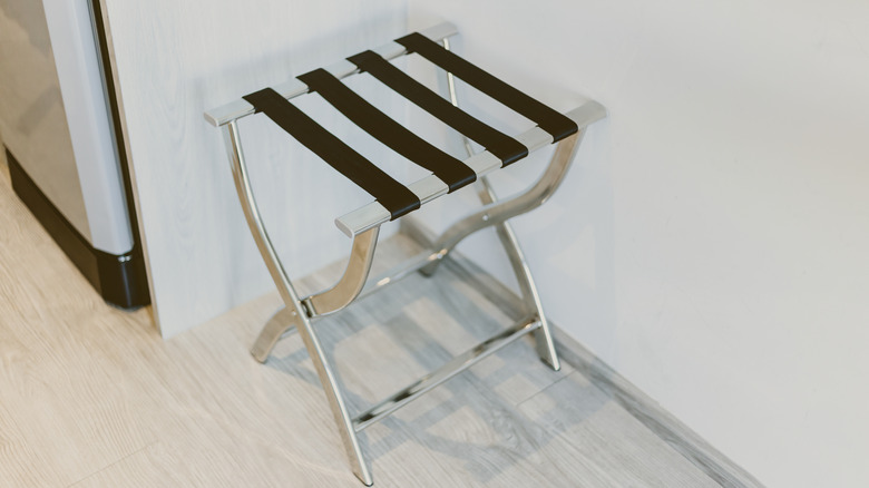 Metal luggage rack with black straps
