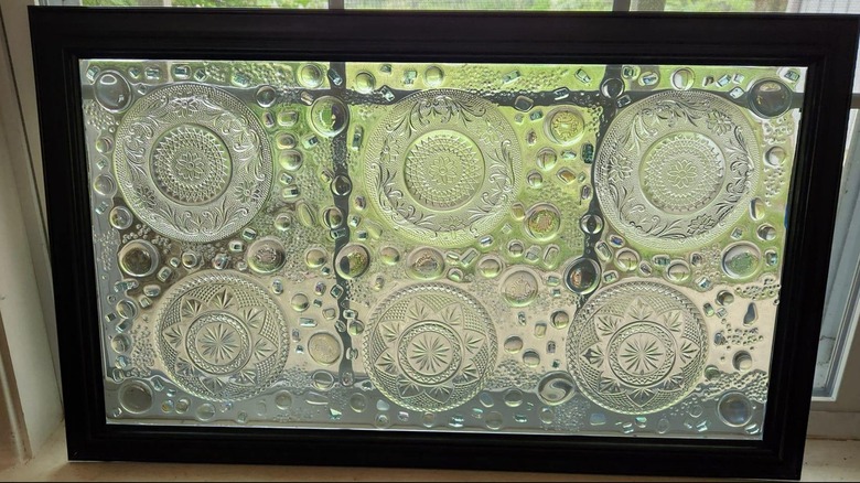 Glass plates resined in window frame