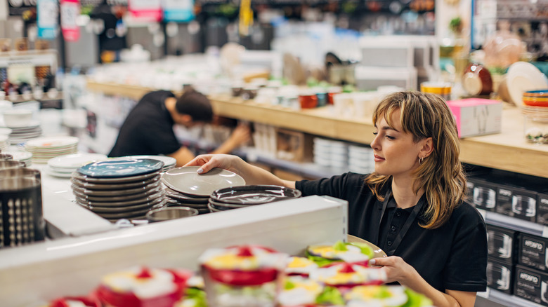 Someone shopping for plates