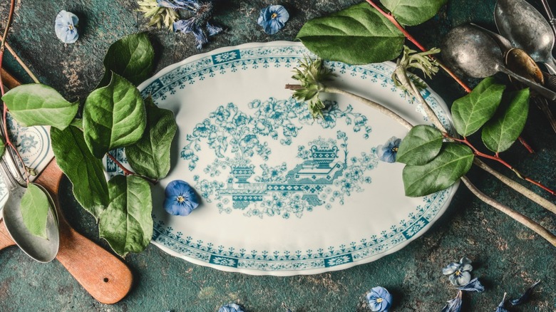 Vintage plate with leaves and spoons