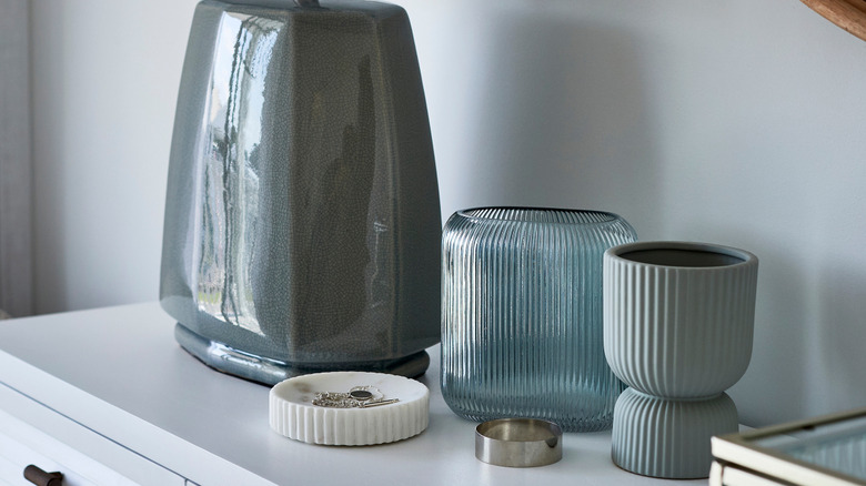 Purple beads in a glass vase