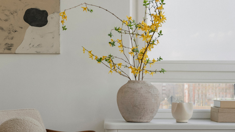 oversized vase with florals on a table