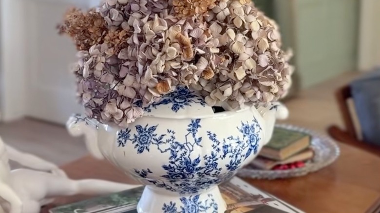 Blue and white floral soup tureen with a flowers on top