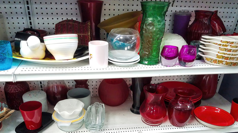 Thrift store shelves filled with kitchen items