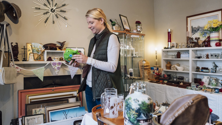 A person shopping at the thrift store for home decor
