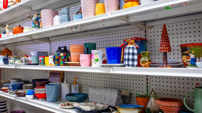 thrift store shelves with planters and other decor