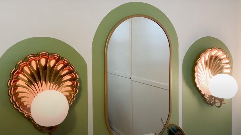 Broze shell wall sconces with cordless lights