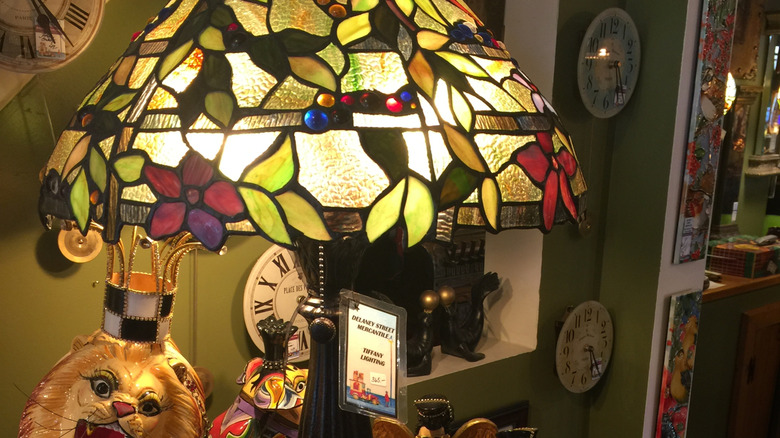 A Tiffany-style lamp for sale in an antique store.