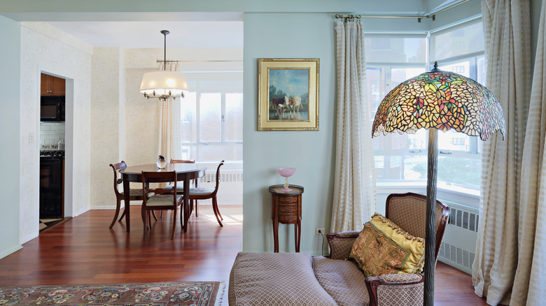 Tiffany lamp in light room with wood