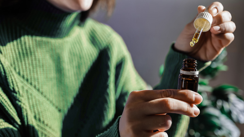 Woman using essential oil