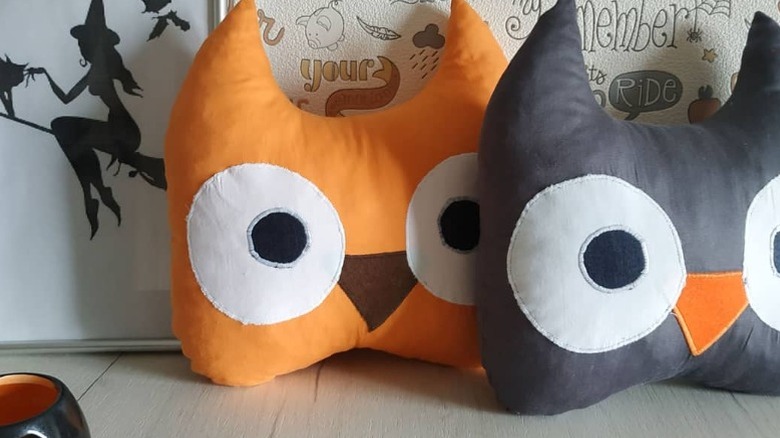orange and black owl pillows