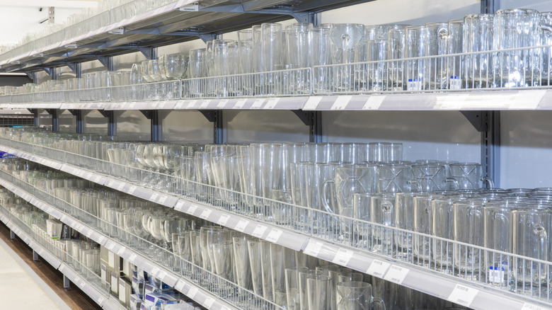 Glassware is on display in a well-lit store.
