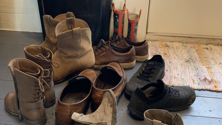 boots in pile by door