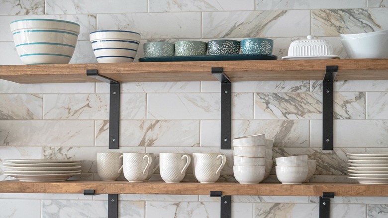 dishes stacked on shelves