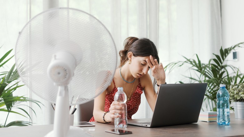 Woman sitting in warm room