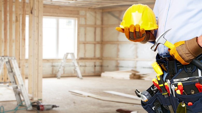 Contractor wearing a tool belt