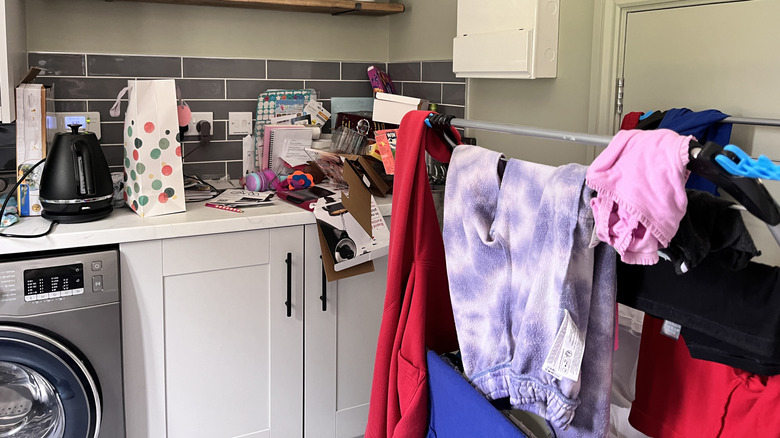 A messy and unorganized laundry room