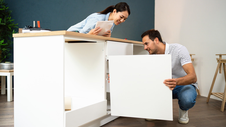 couple building ikea furniture