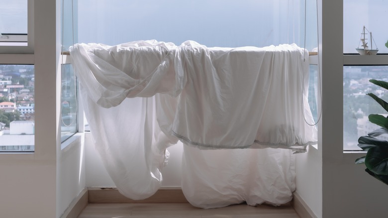 bedding hanging in apartment