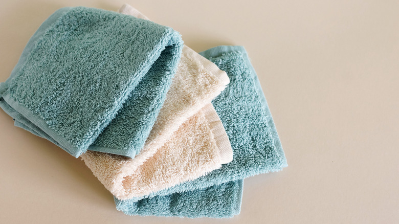 Blue and white hand towels on a table