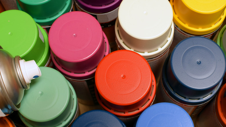 multi-colored spray paint lids