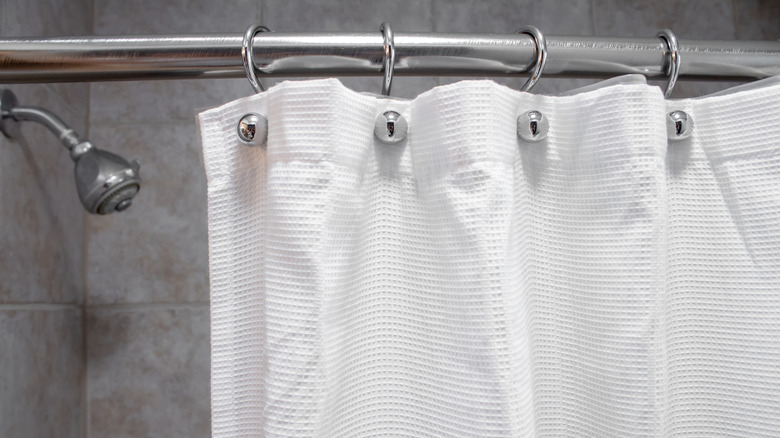 white shower curtain gray wall