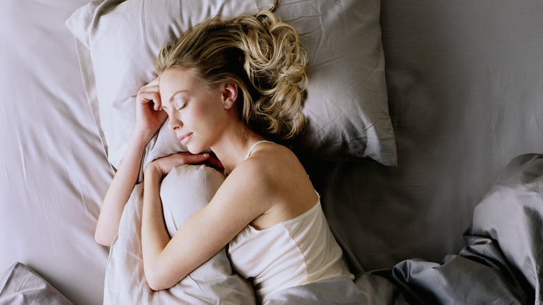woman sleeping on pillow