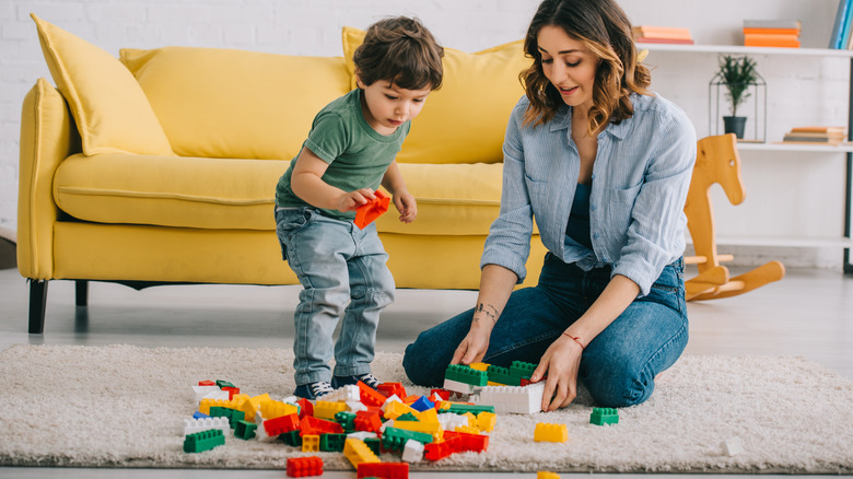 woman and child with LEGOs