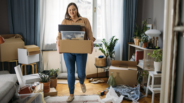 Woman clearing out room