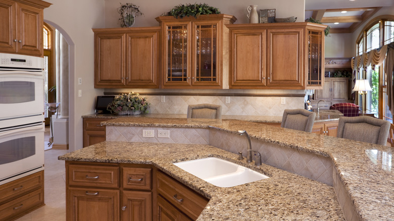 Outdated kitchen with oak cabinets