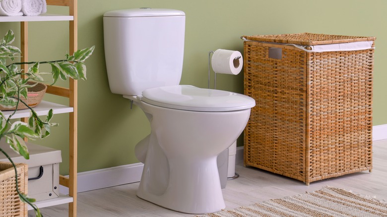 basket next to toilet