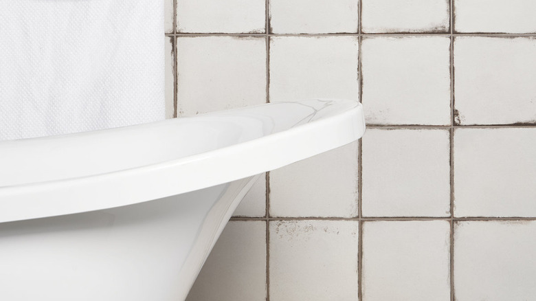 Plaster style bathroom wall tiles.