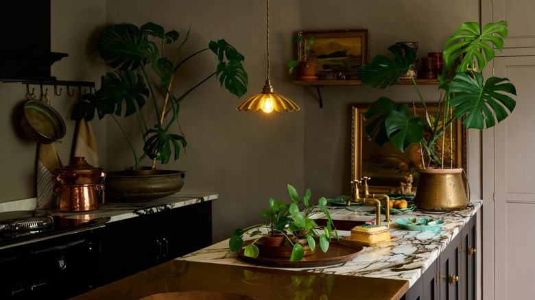 Vintage oil paintings and countertop decor in a modern kitchen