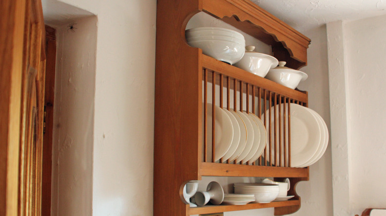 wooden plate rack on kitchen wall