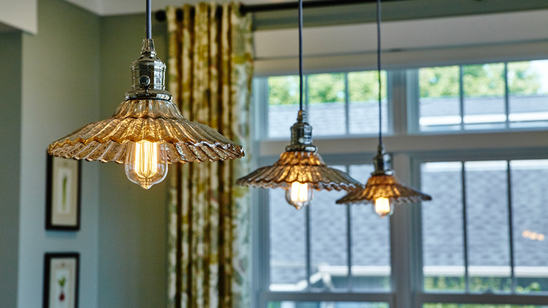 Pleated glass lamps in kitchen