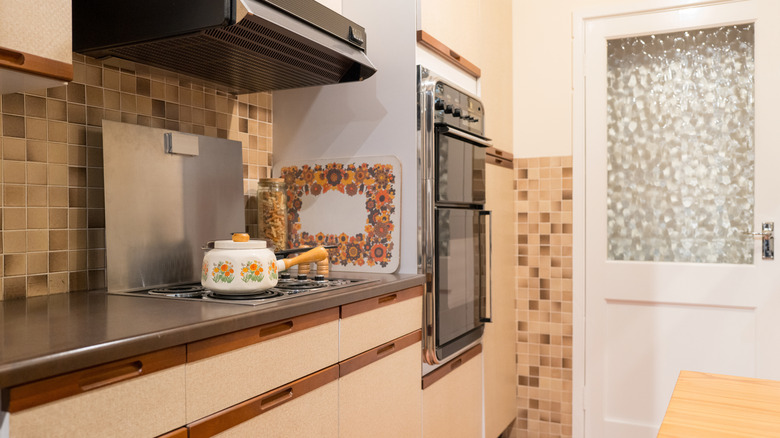 Original 1970s kitchen with neutral colors and vintage accessories