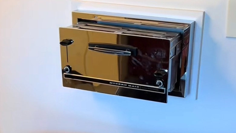 close up of a vintage built-in wall toaster