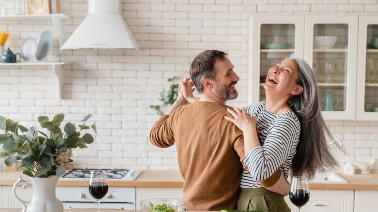 couple dancing in kitchen