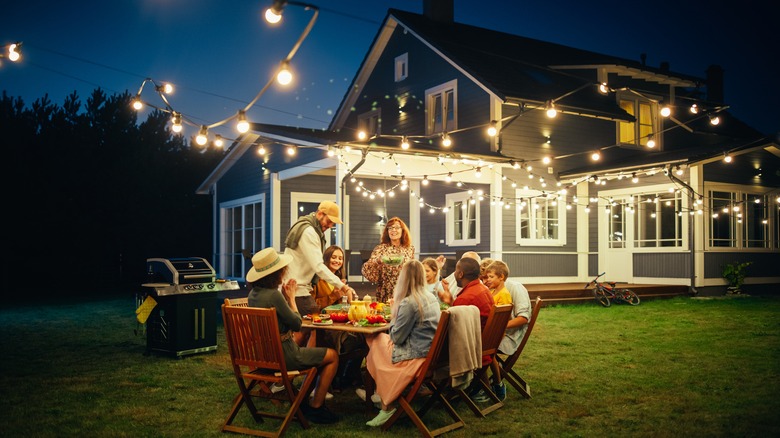 Outdoor dinner party at dusk