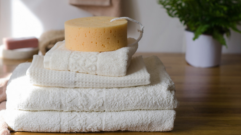 White folded towels with sponge