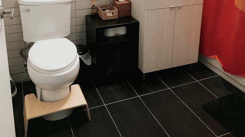 Cute bathroom with wooden Squatty Potty from @michonce on Instagram