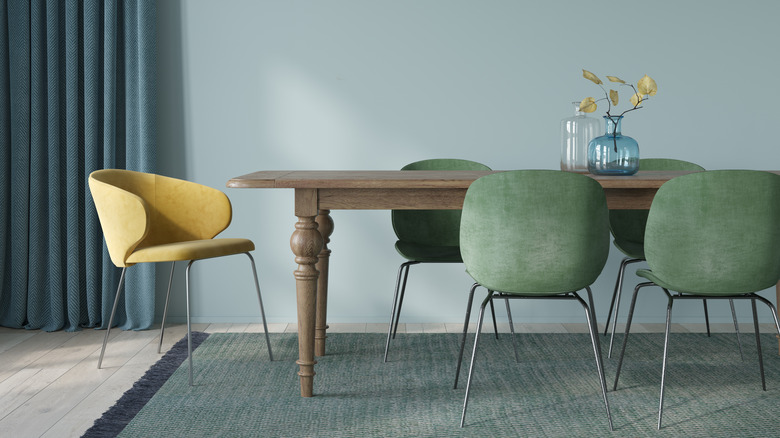 Wooden dining table with modern chairs