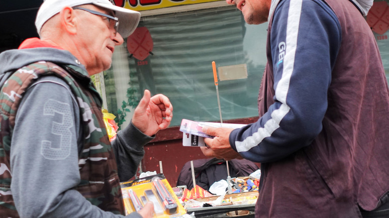 Two men haggling over prices