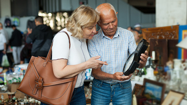Older couple shopping at market together