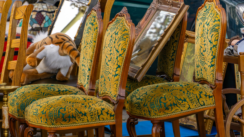 Colorful upholstery of green and gold on chairs