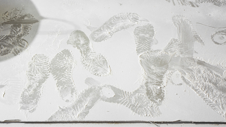 Footprints in drywall dust