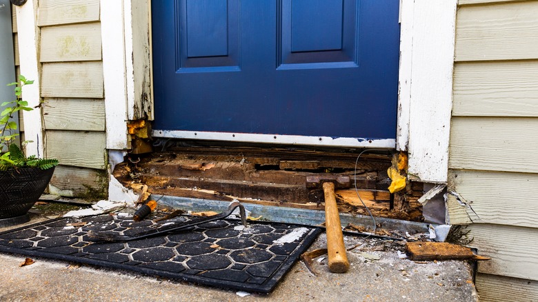 rotting wood under front door